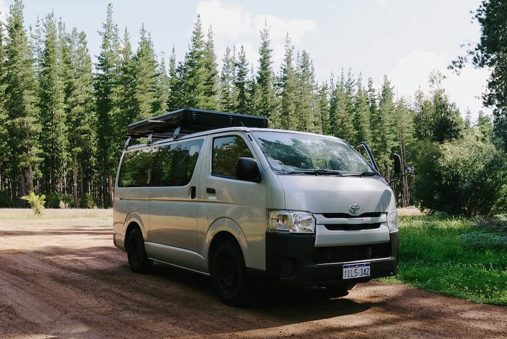 2-5 seater campervan hire in front of pine forrest plantation